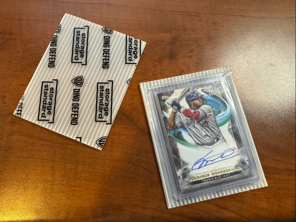 Team bagged card between two rigid cards.