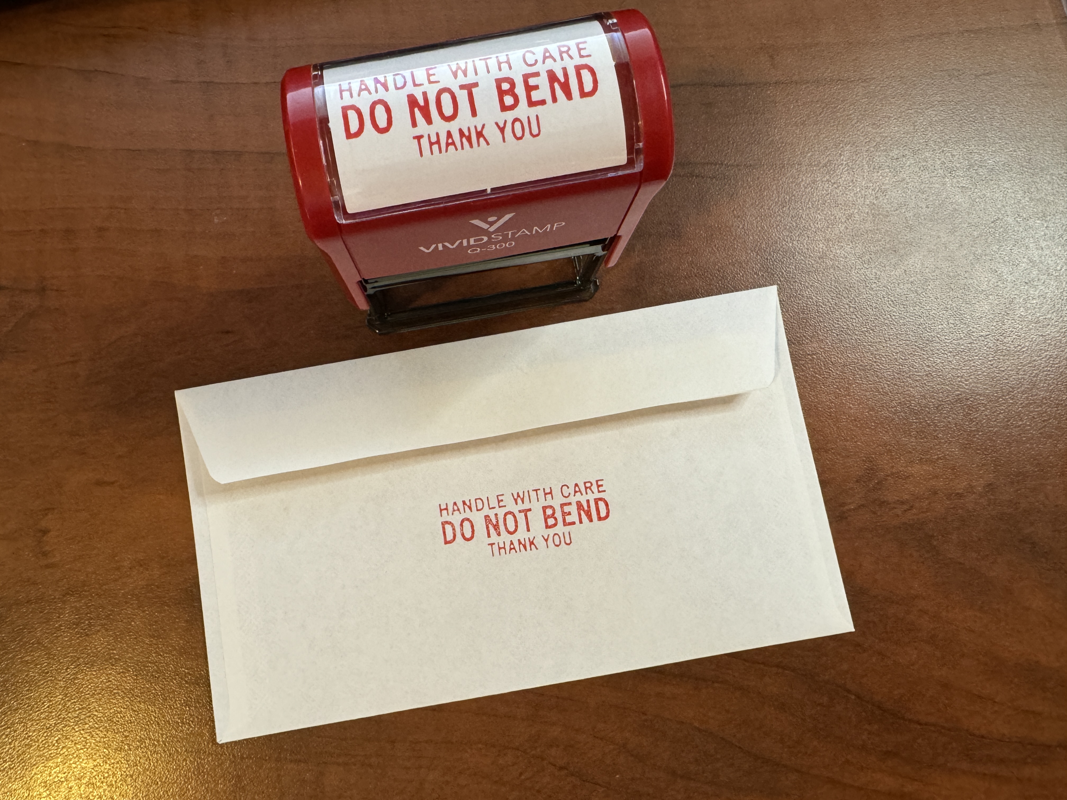 Envelope stamped with "Handle with Care, Do Not Bend, Thank You"